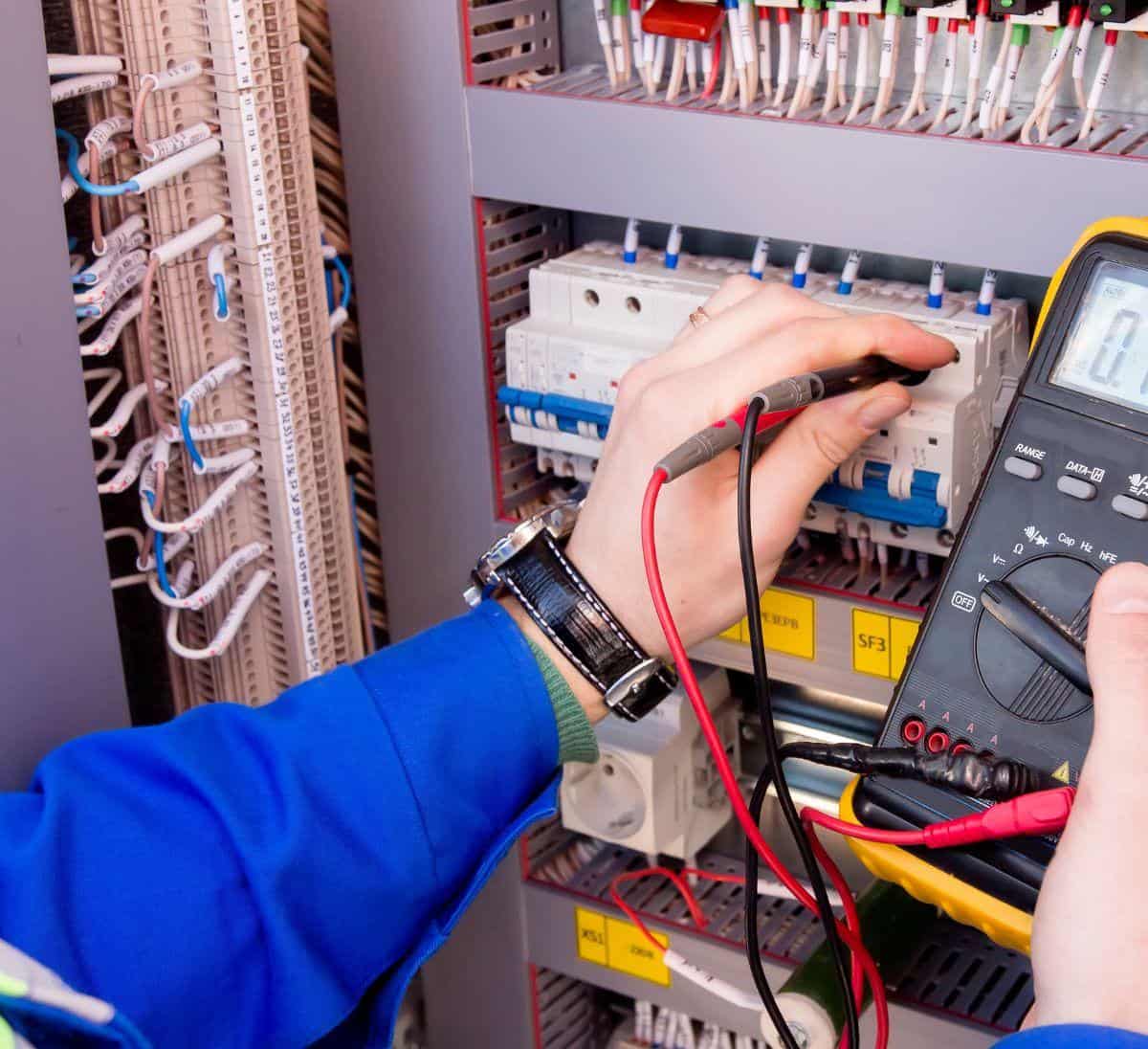 Man working on a control system for automation